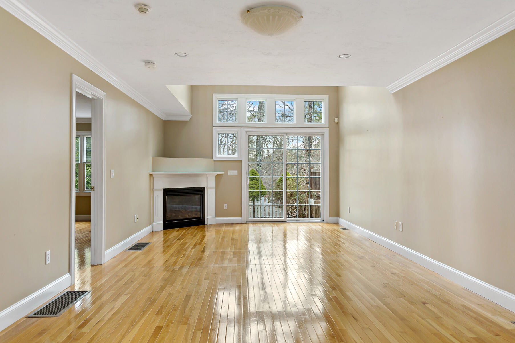 4 Gold Leaf Lane Mashpee, MA 02649 - Photo 12 of 33 a view of an empty room with wooden floor and a window