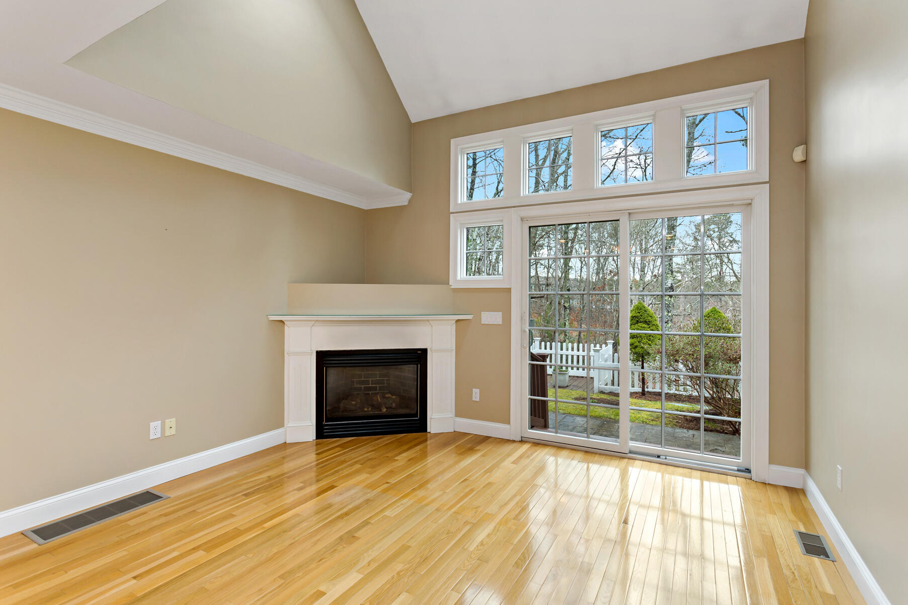 4 Gold Leaf Lane Mashpee, MA 02649 - Photo 14 of 33 a view of an empty room with wooden floor and a window