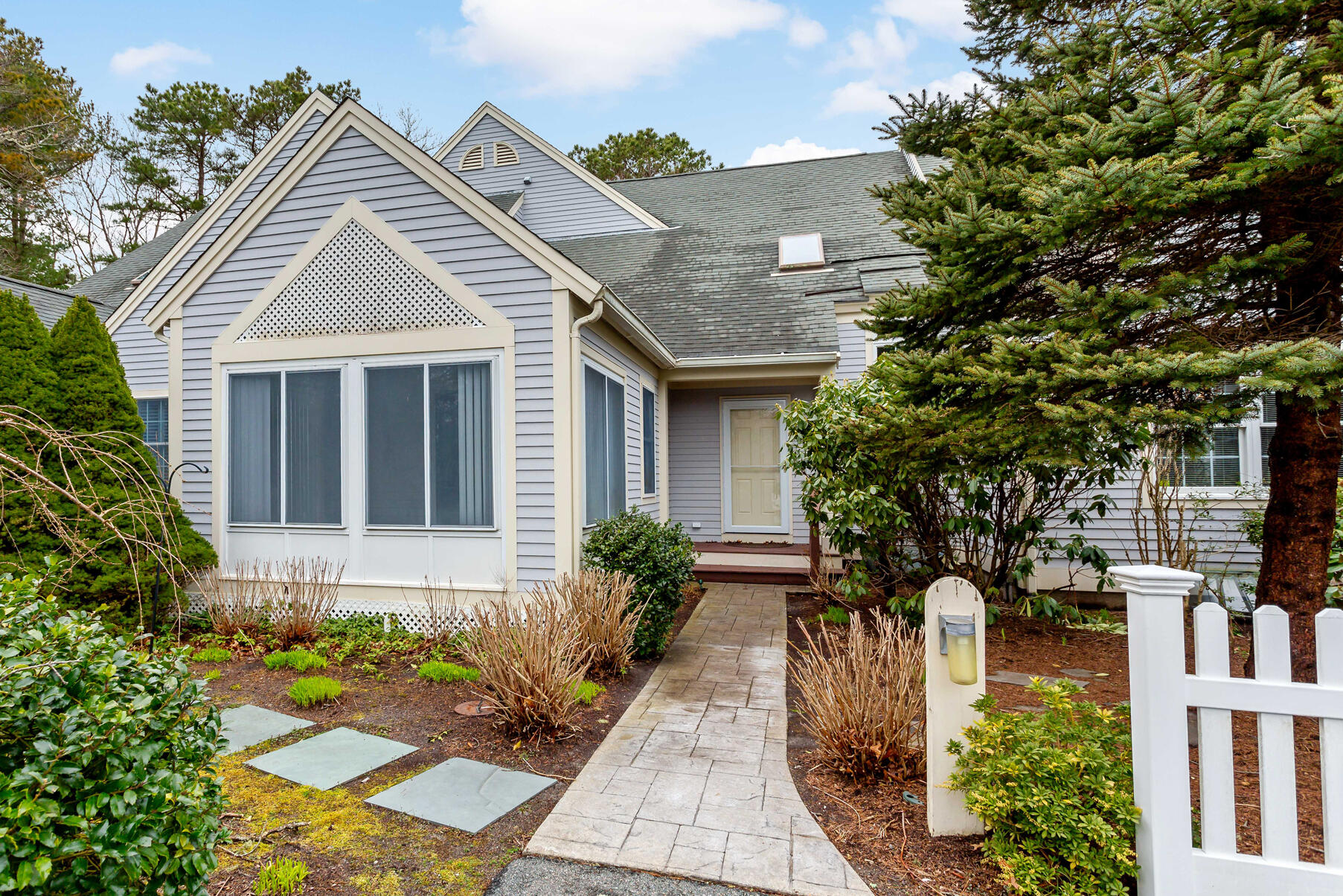 4 Gold Leaf Lane Mashpee, MA 02649 - Photo 2 of 33 a front view of a house with garden