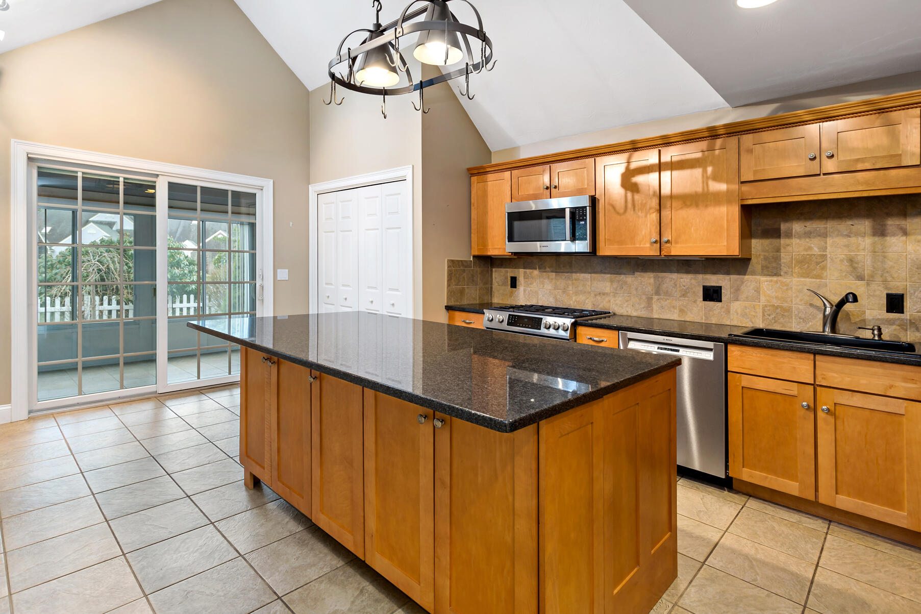 4 Gold Leaf Lane Mashpee, MA 02649 - Photo 3 of 33 a kitchen with stainless steel appliances granite countertop a sink and cabinets