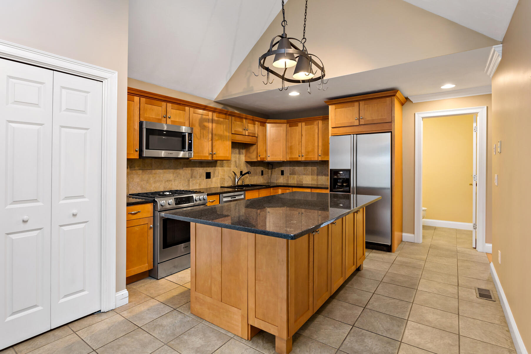4 Gold Leaf Lane Mashpee, MA 02649 - Photo 4 of 33 a kitchen with stainless steel appliances granite countertop a sink and a refrigerator