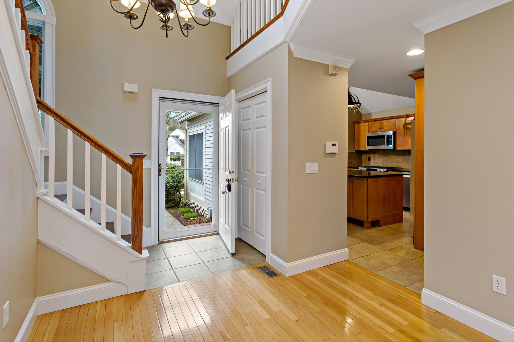 4 Gold Leaf Lane Mashpee, MA 02649 - Photo 10 of 33 a view of a hallway view with wooden floor and staircase