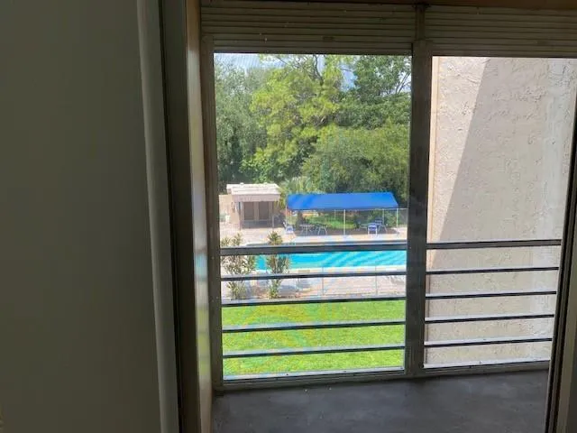 a room with a bed and a window