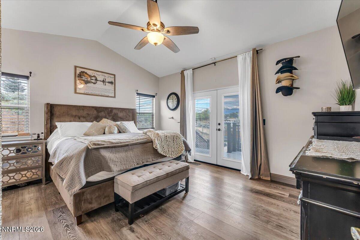 15770 Rocky Vista Road Reno, NV 89521 - Photo 19 of 68 a bedroom with a bed and a chandelier