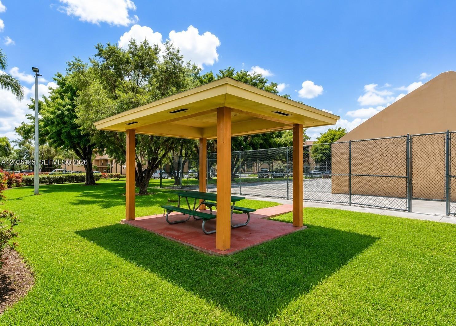 8400 Southwest 133rd Avenue Road, Unit 121 Miami, FL 33183 - Photo 11 of 43 a view of a house with a yard porch and sitting area