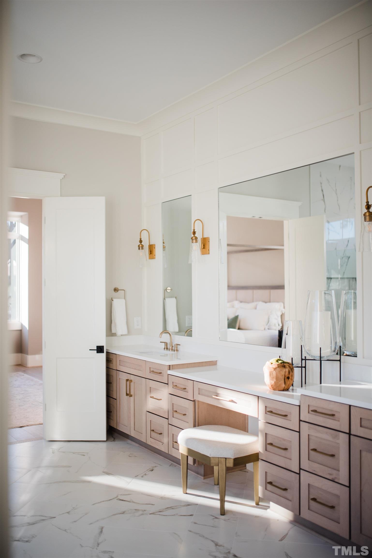 1000 Casa Dega Way Raleigh, NC 27615 - Photo 14 of 22 a spacious bathroom with a double vanity sink a mirror and a bathtub