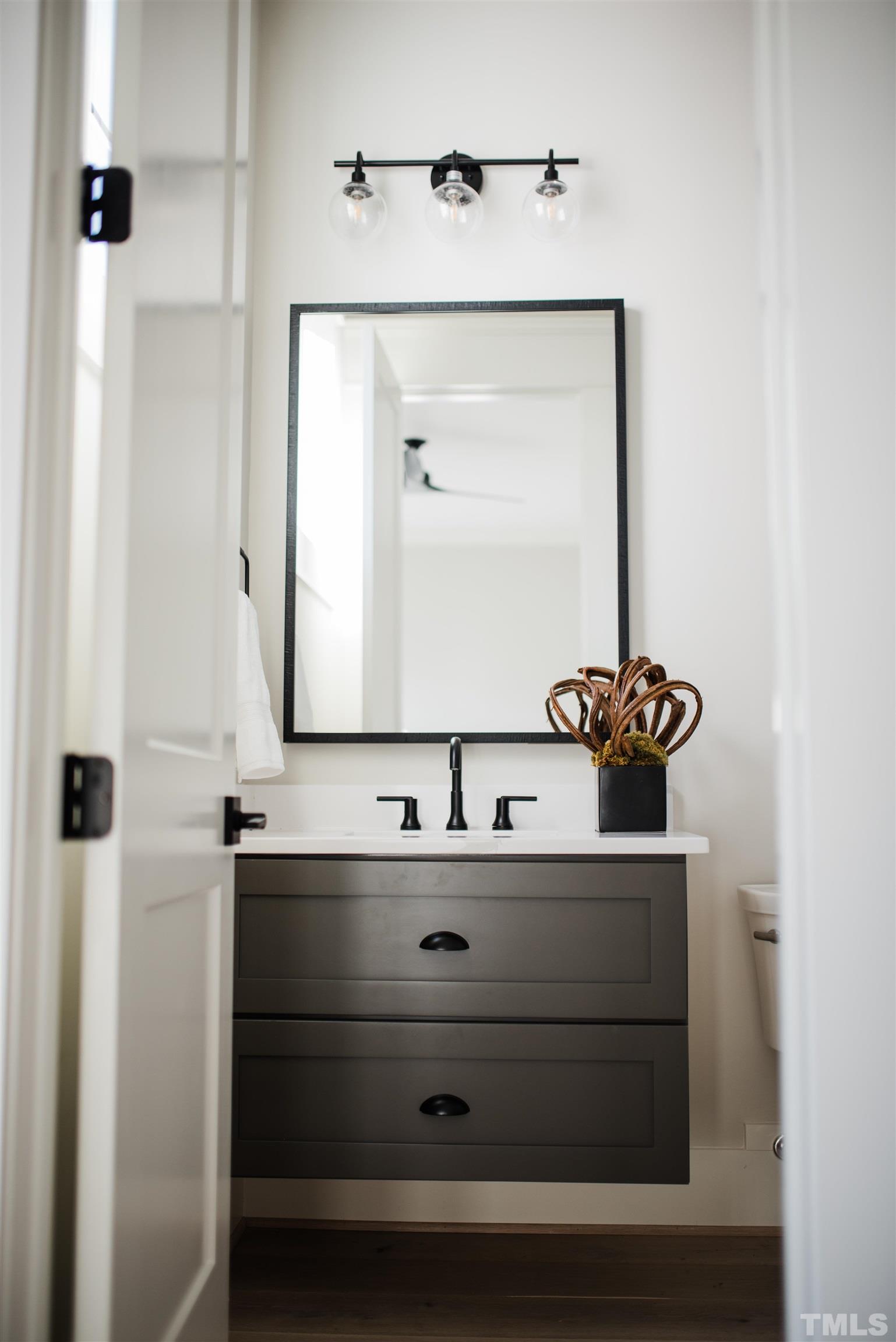 1000 Casa Dega Way Raleigh, NC 27615 - Photo 19 of 22 a bathroom with a sink and a mirror