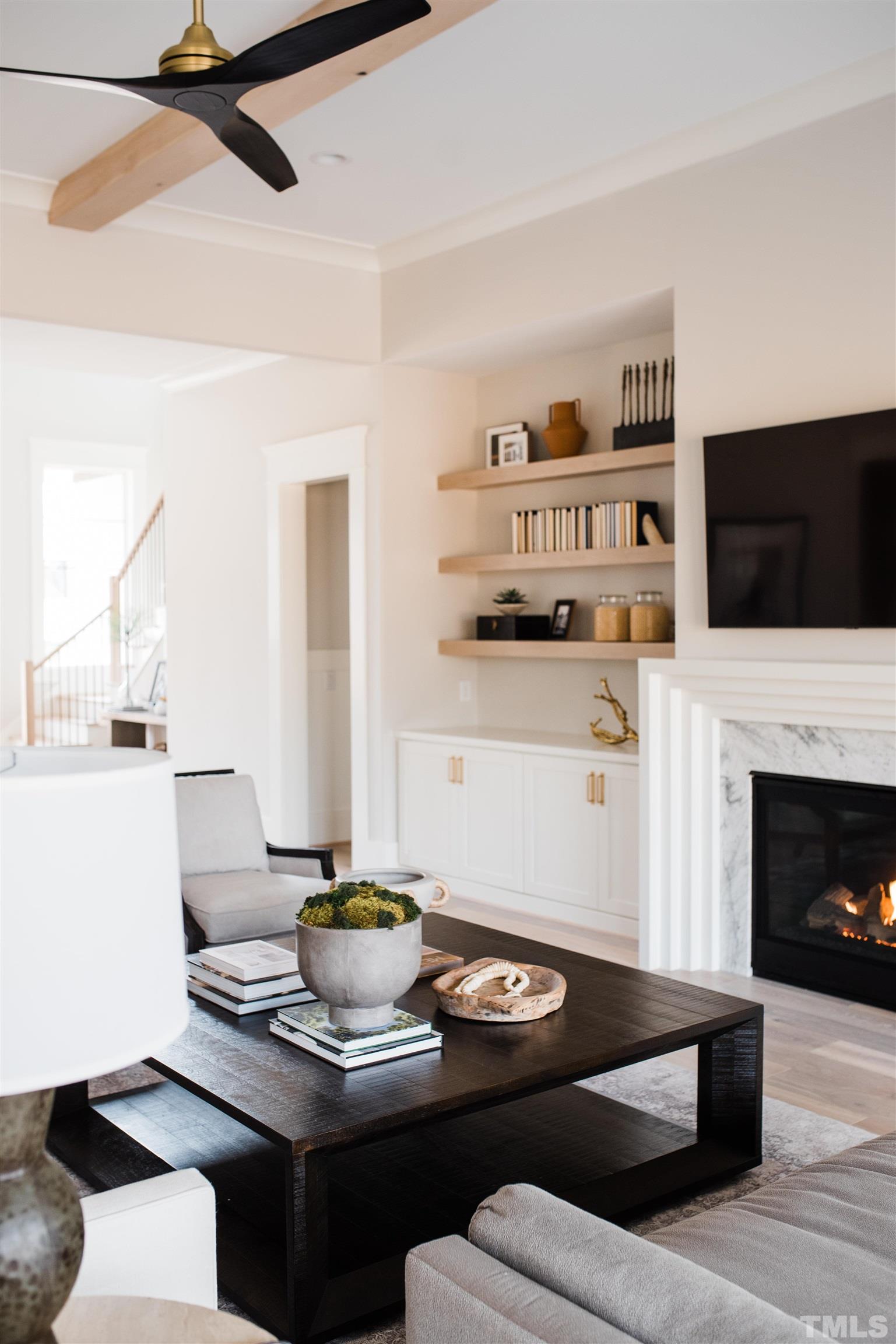 1000 Casa Dega Way Raleigh, NC 27615 - Photo 6 of 22 a living room with furniture a flat screen tv and a fireplace