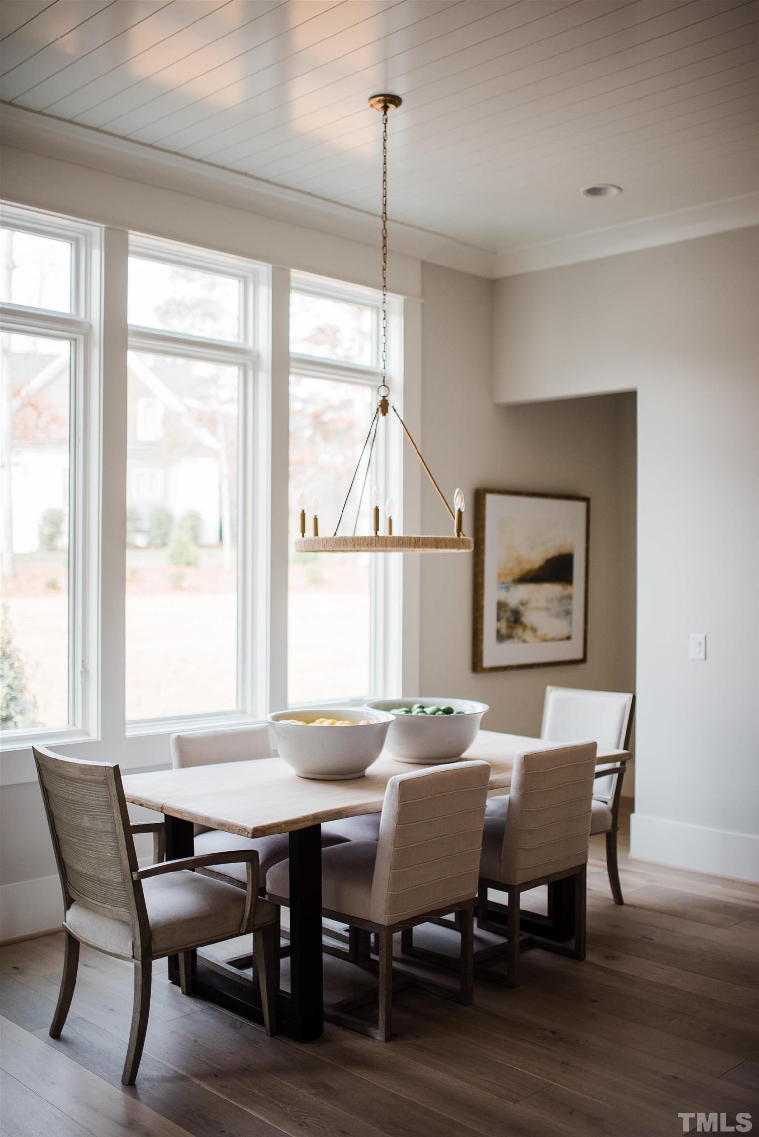 1000 Casa Dega Way Raleigh, NC 27615 - Photo 8 of 22 a dining room with furniture a rug and wooden floor