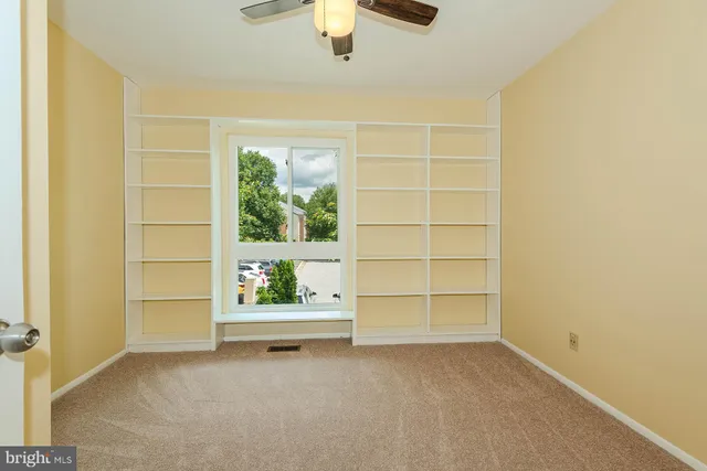 a living room with furniture rug and wooden floor