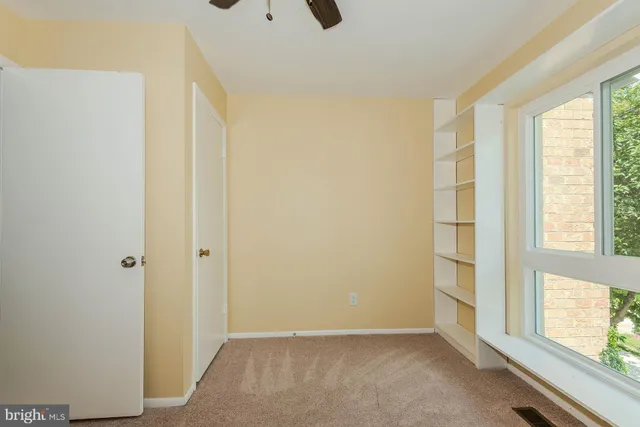 a view of room with wooden floor and window