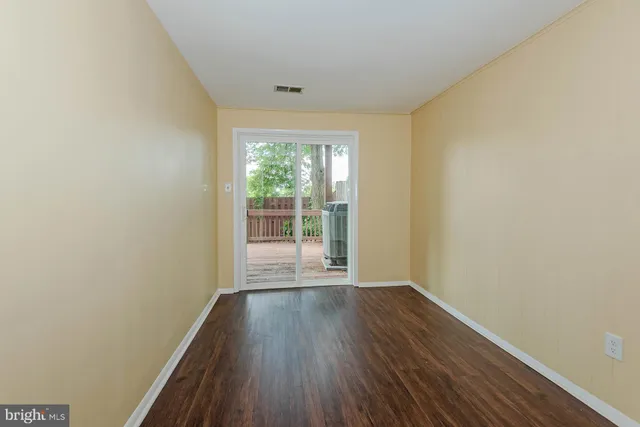 a bathroom with a sink a toilet a mirror and shower