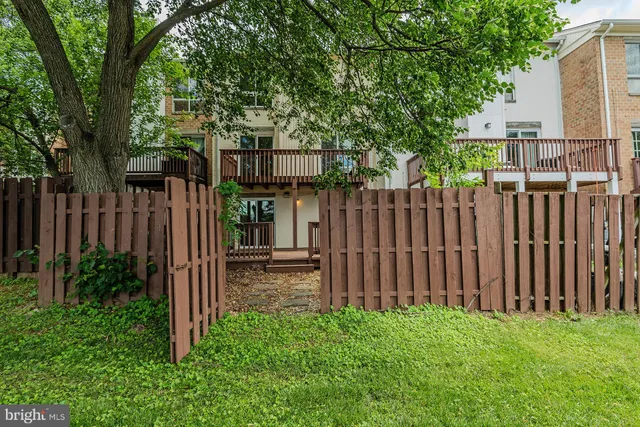 a view of a garden with an outdoor seating