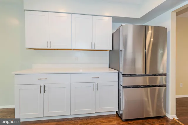 a white refrigerator freezer sitting in a kitchen