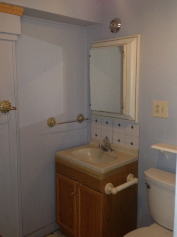 1-n063 Ridgeland Avenue West Chicago, IL 60185 - Photo 20 of 25 a bathroom with a sink and a toilet