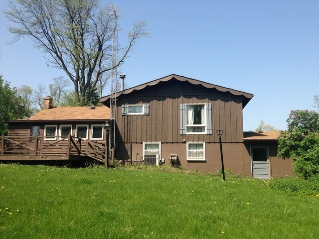 1-n063 Ridgeland Avenue West Chicago, IL 60185 - Photo 4 of 25 a front view of a house with a yard