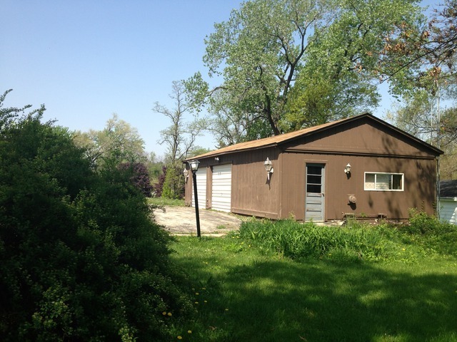 1-n063 Ridgeland Avenue West Chicago, IL 60185 - Photo 5 of 25 a house with green field in front of it