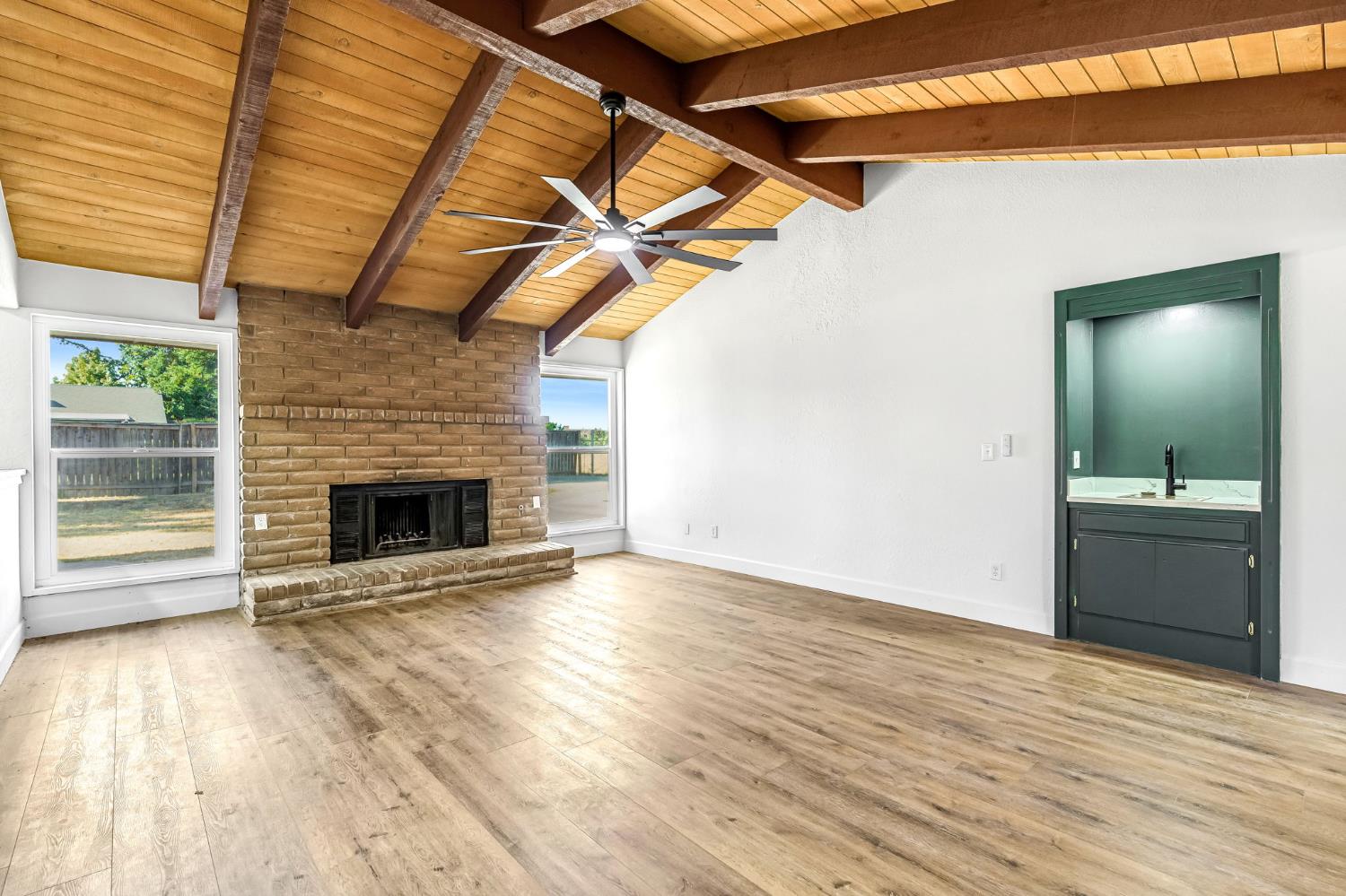 146 Sierra Avenue Clovis, CA 93612 - Photo 14 of 45 a view of a livingroom with a fireplace and wooden floor