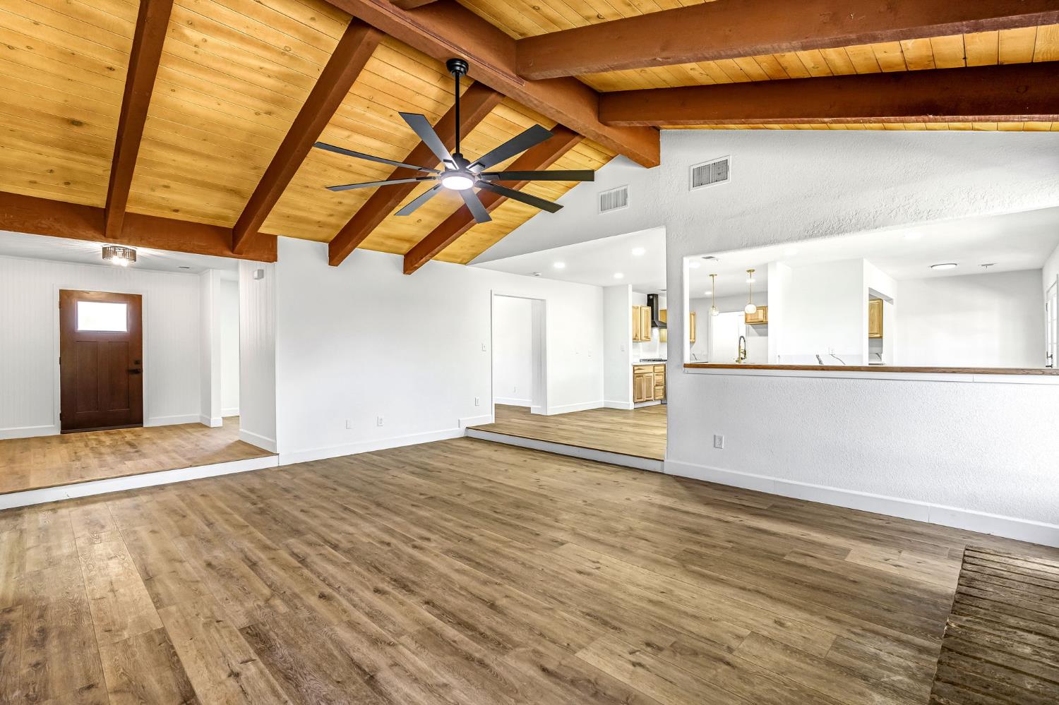 146 Sierra Avenue Clovis, CA 93612 - Photo 16 of 45 a view of an empty room with kitchen natural and wooden floor