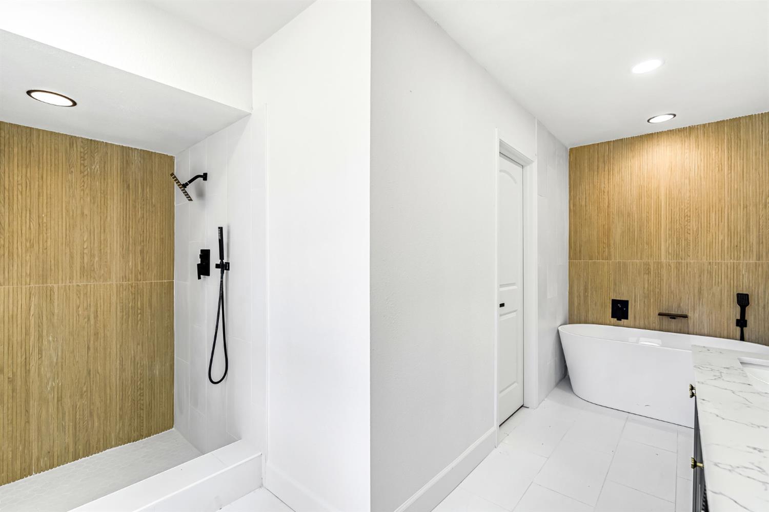 146 Sierra Avenue Clovis, CA 93612 - Photo 27 of 45 a bathroom with a bathtub and shower