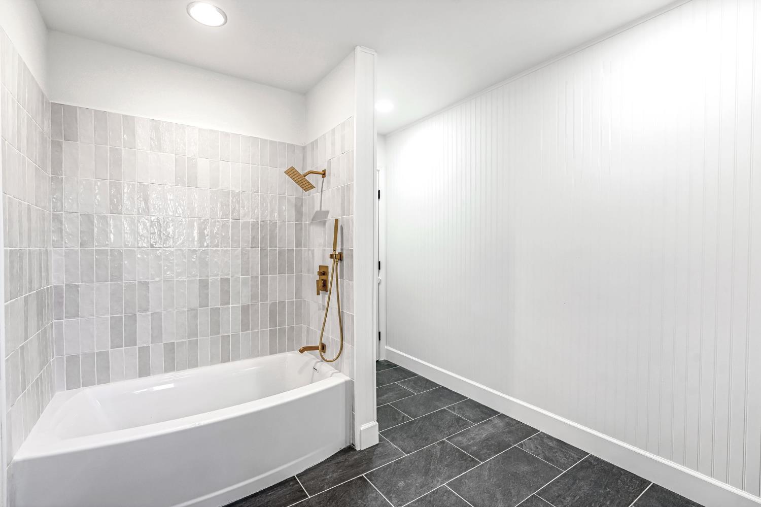 146 Sierra Avenue Clovis, CA 93612 - Photo 34 of 45 a bathroom with a bathtub and shower