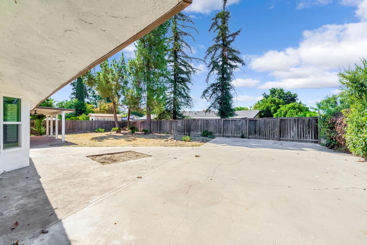 146 Sierra Avenue Clovis, CA 93612 - Photo 36 of 45 a view of white house with a yard and potted plants