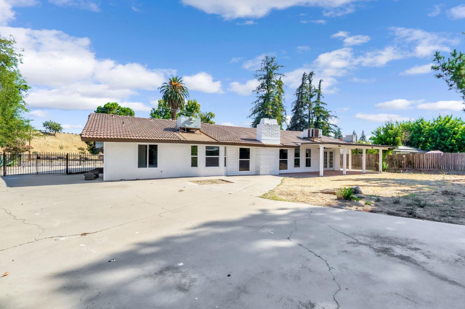 146 Sierra Avenue Clovis, CA 93612 - Photo 37 of 45 a front view of a house with a yard