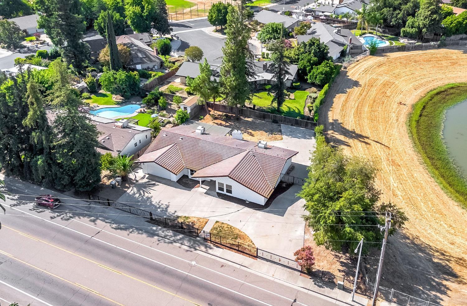 146 Sierra Avenue Clovis, CA 93612 - Photo 39 of 45 an aerial view of a house with a yard and trees