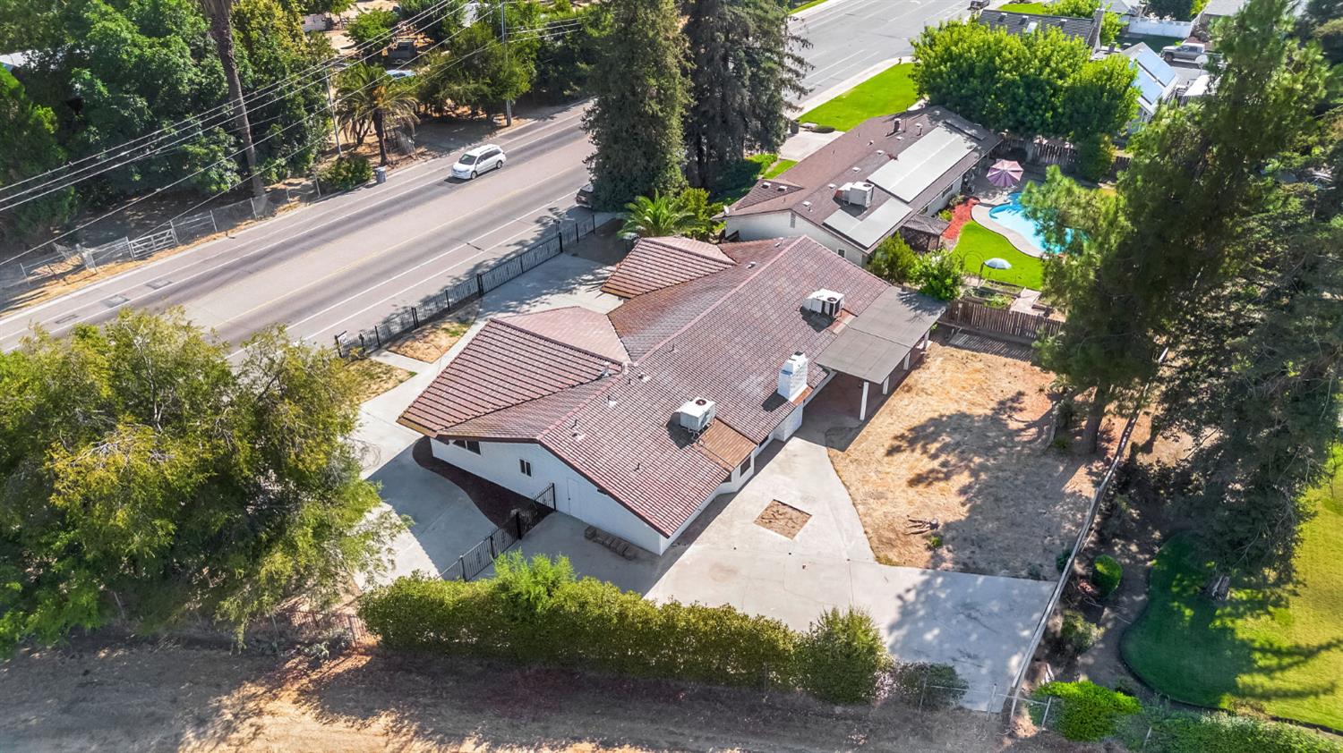 146 Sierra Avenue Clovis, CA 93612 - Photo 40 of 45 an aerial view of a house with a yard and trees