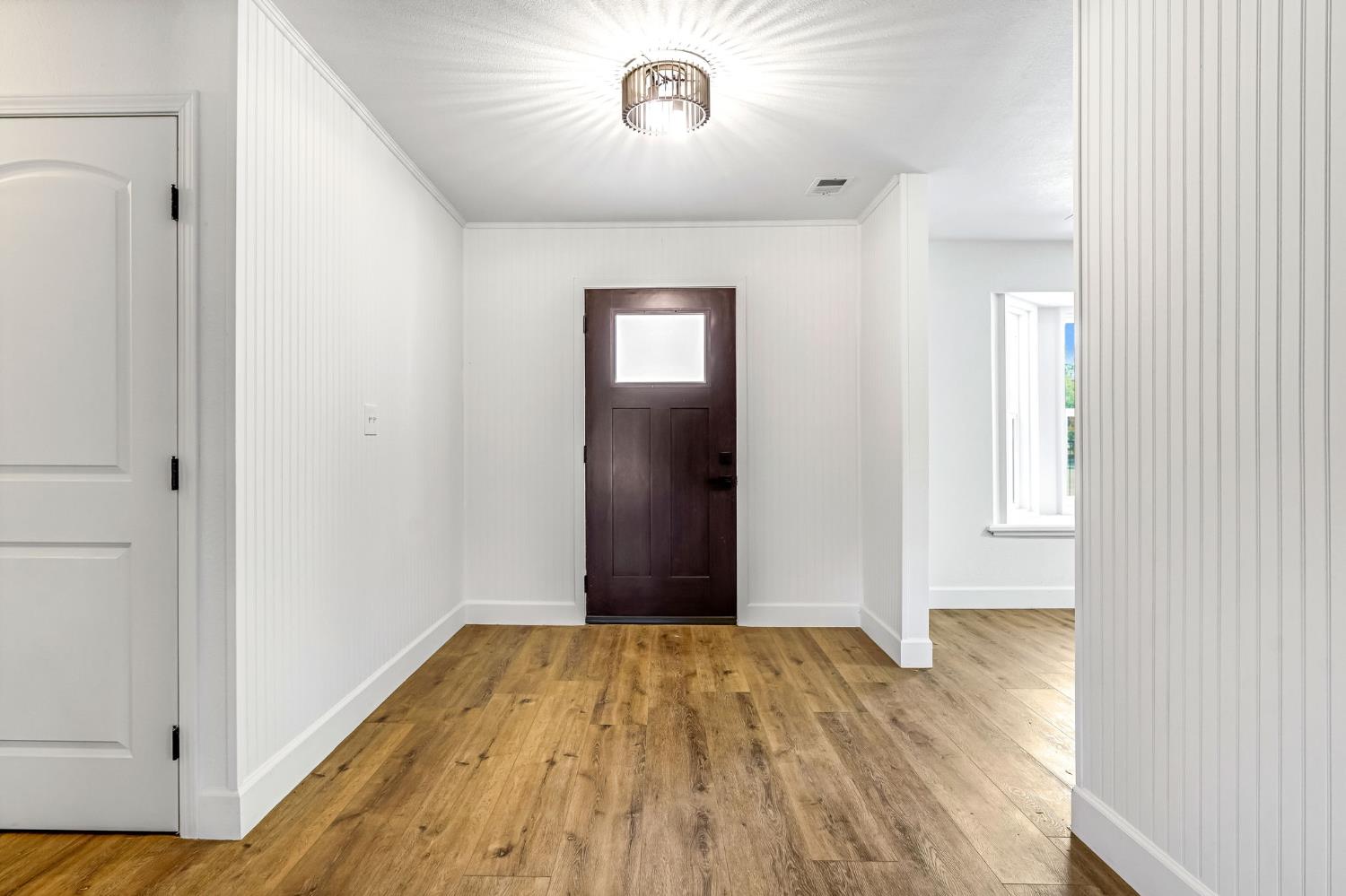 146 Sierra Avenue Clovis, CA 93612 - Photo 4 of 45 a view of empty room with wooden floor