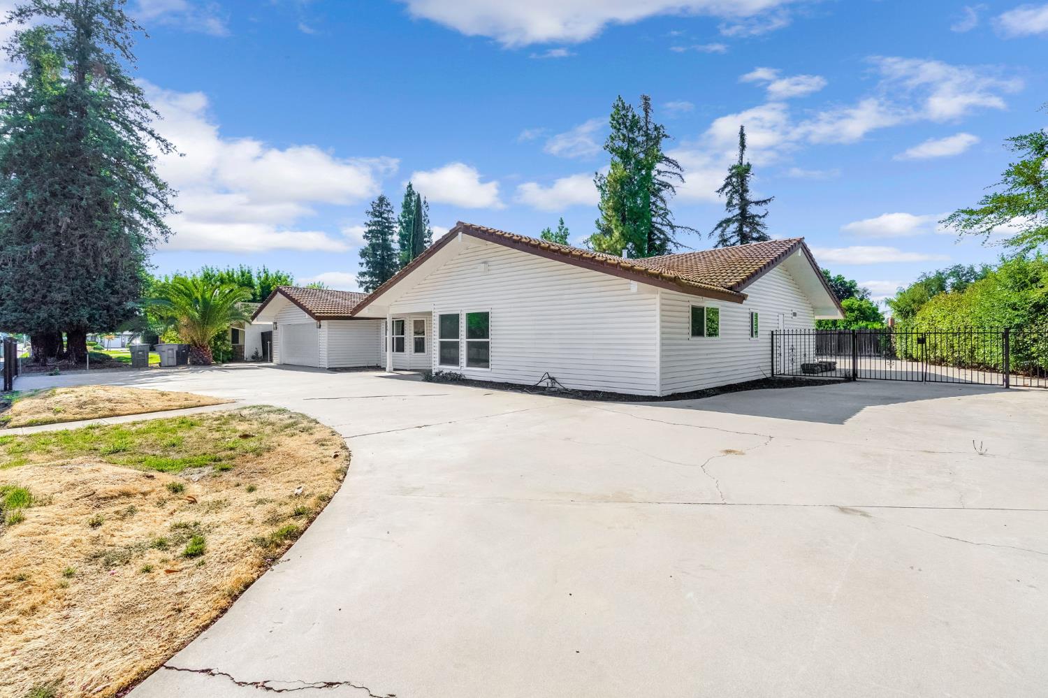 146 Sierra Avenue Clovis, CA 93612 - Photo 43 of 45 a view of white house with a yard