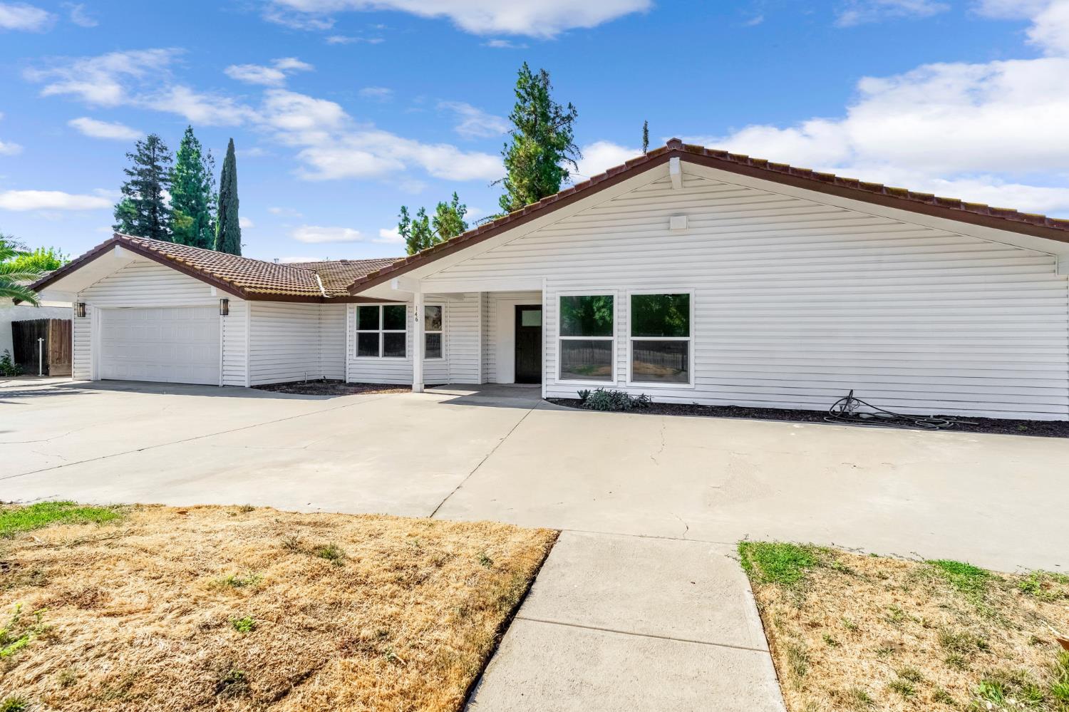 146 Sierra Avenue Clovis, CA 93612 - Photo 45 of 45 a house with trees in the background