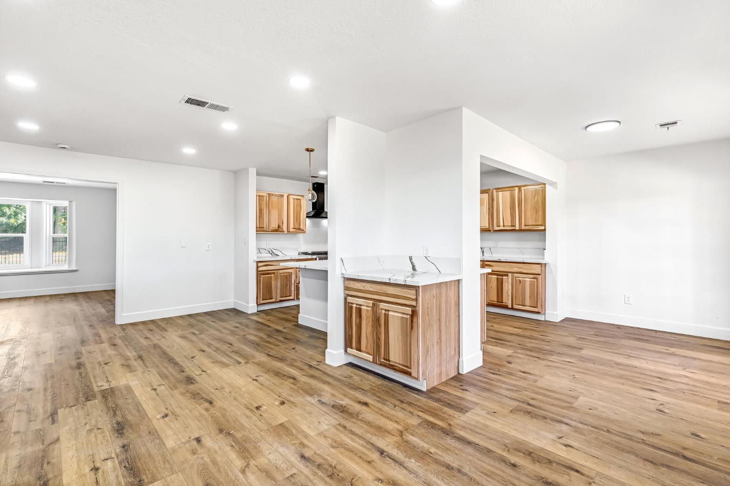 146 Sierra Avenue Clovis, CA 93612 - Photo 10 of 45 a kitchen with a sink cabinets stainless steel appliances and a window