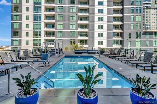 a lobby with a potted plant and a table