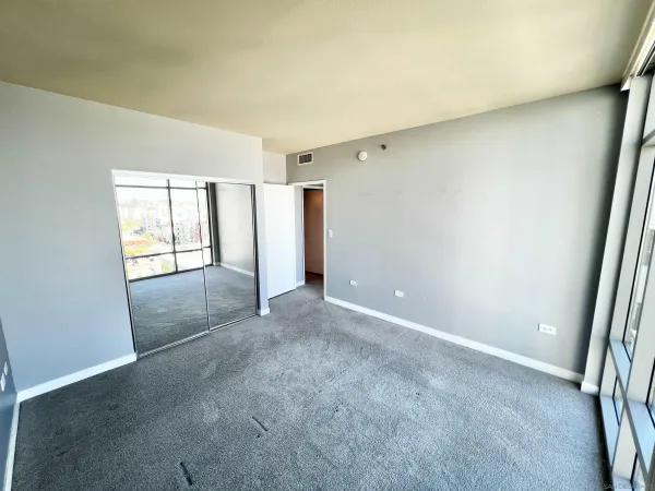 an empty room with glass door