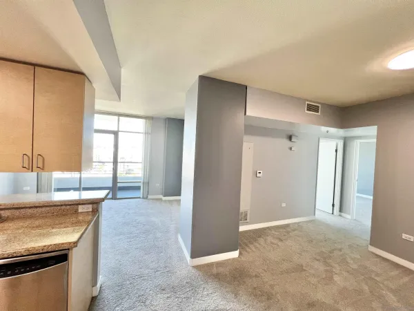 wooden floor and window in an empty room