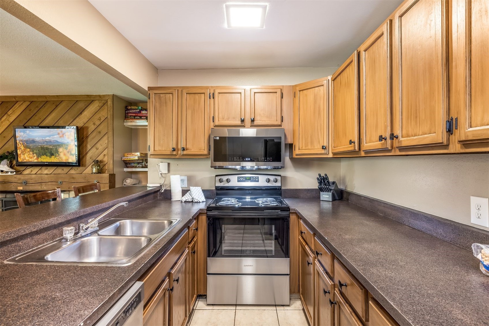 1977 Soda Ridge Road, Unit 1194 Keystone, CO 80435 - Photo 13 of 44 a kitchen with a sink a counter top space cabinets and stainless steel appliances