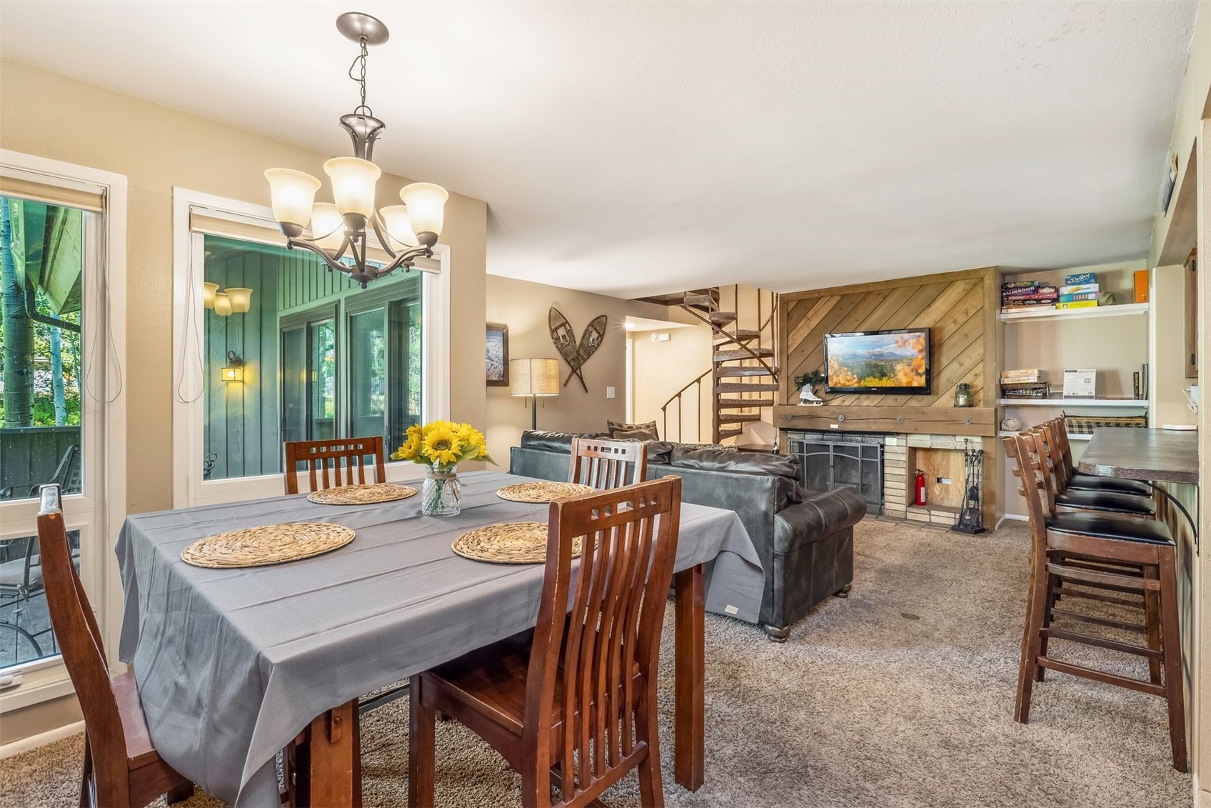 1977 Soda Ridge Road, Unit 1194 Keystone, CO 80435 - Photo 15 of 44 a view of a dining room with furniture wooden floor and chandelier