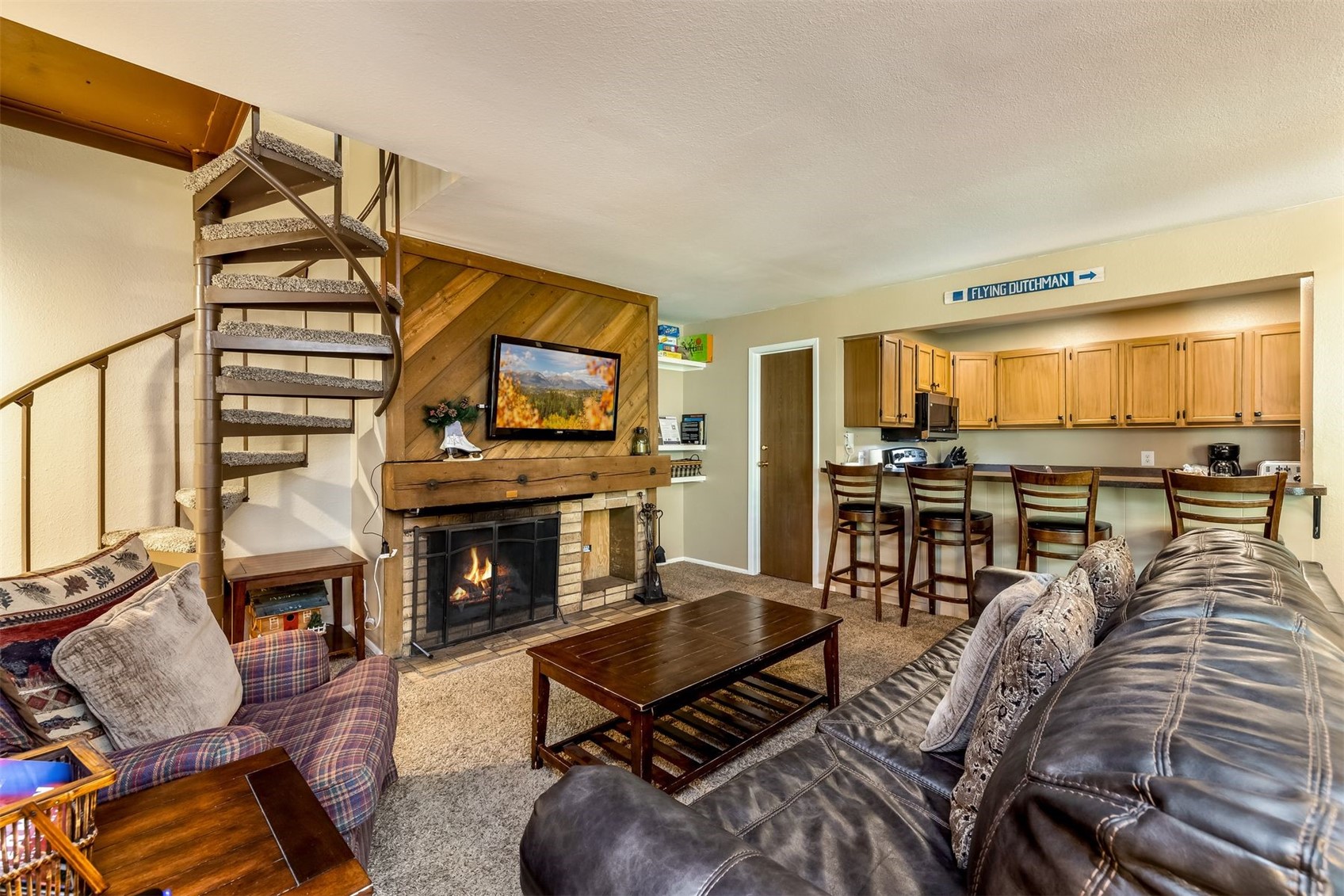 1977 Soda Ridge Road, Unit 1194 Keystone, CO 80435 - Photo 23 of 44 a living room with furniture and a fireplace