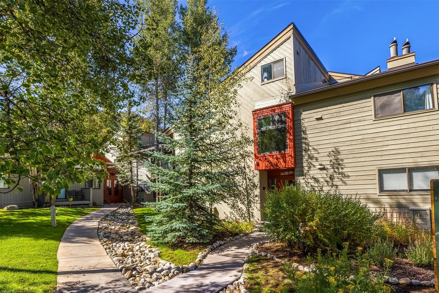 1977 Soda Ridge Road, Unit 1194 Keystone, CO 80435 - Photo 34 of 44 a front view of a house with a yard