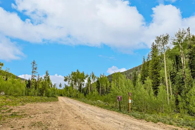 a view of a road with a building in background