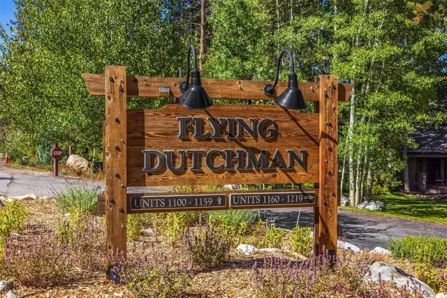 a view of a sign board with yard