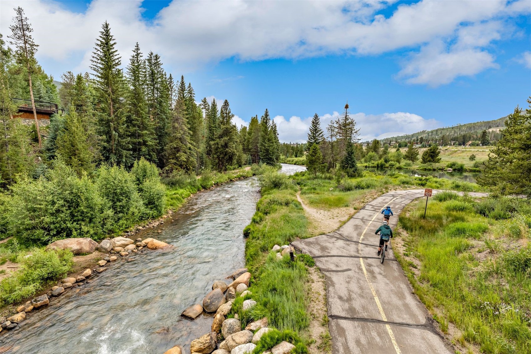 1977 Soda Ridge Road, Unit 1194 Keystone, CO 80435 - Photo 7 of 44 a view of a pathway both side of houses with yard