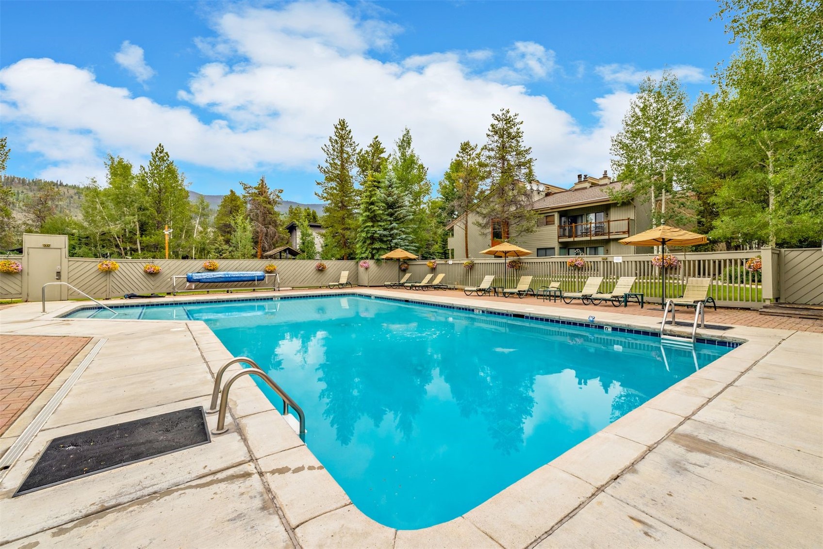 1977 Soda Ridge Road, Unit 1194 Keystone, CO 80435 - Photo 9 of 44 a view of swimming pool with a table and chairs