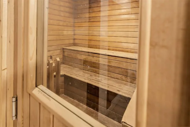 a bathroom with a shower and vanity