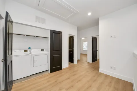 a view of a kitchen with a refrigerator