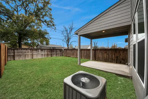 a backyard of a house with trampoline