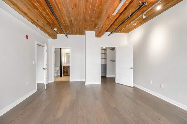 a view of a livingroom with wooden floor