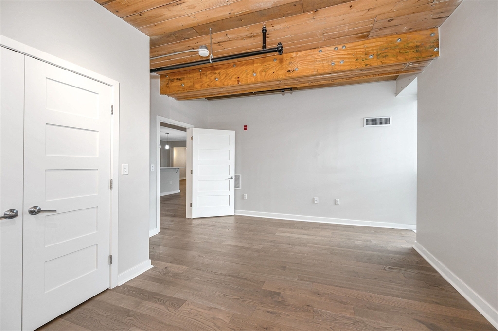 130 John Street, Unit 355 Lowell, MA 01852 - Photo 18 of 34 a view of a room with wooden floor