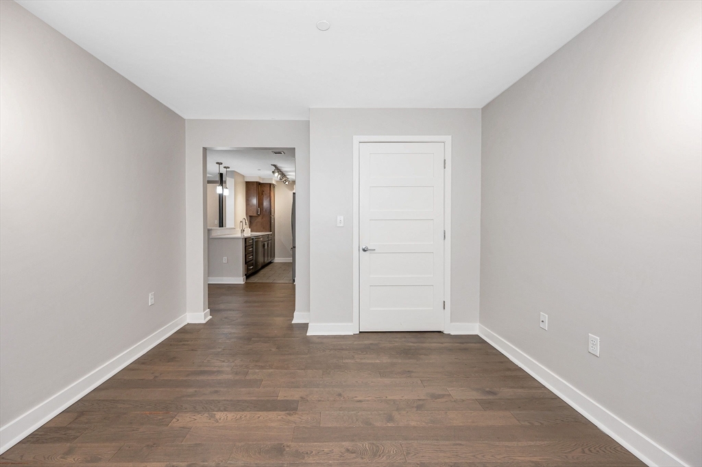 130 John Street, Unit 355 Lowell, MA 01852 - Photo 7 of 34 wooden floor in an empty room